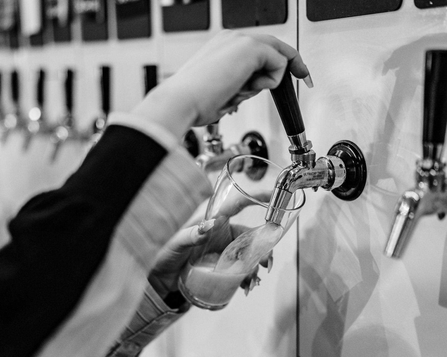 Beer being poured at Liberty Brewing Taproom